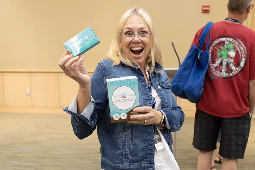 Attendee celebrating a giveaway prize at Hack Your Health